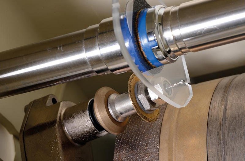 automatic lens edging process for precise beveling grooving and polishing