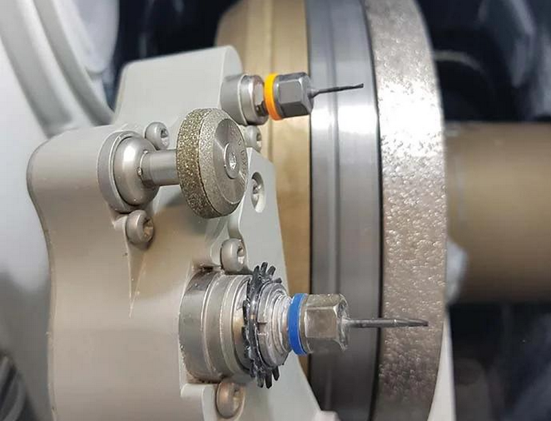 Lens edger grinding wheels and drilling tools